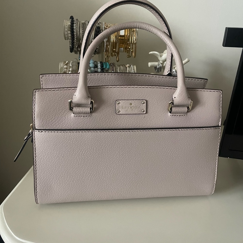 Kate Spade satchel bag with crossbody strap.
